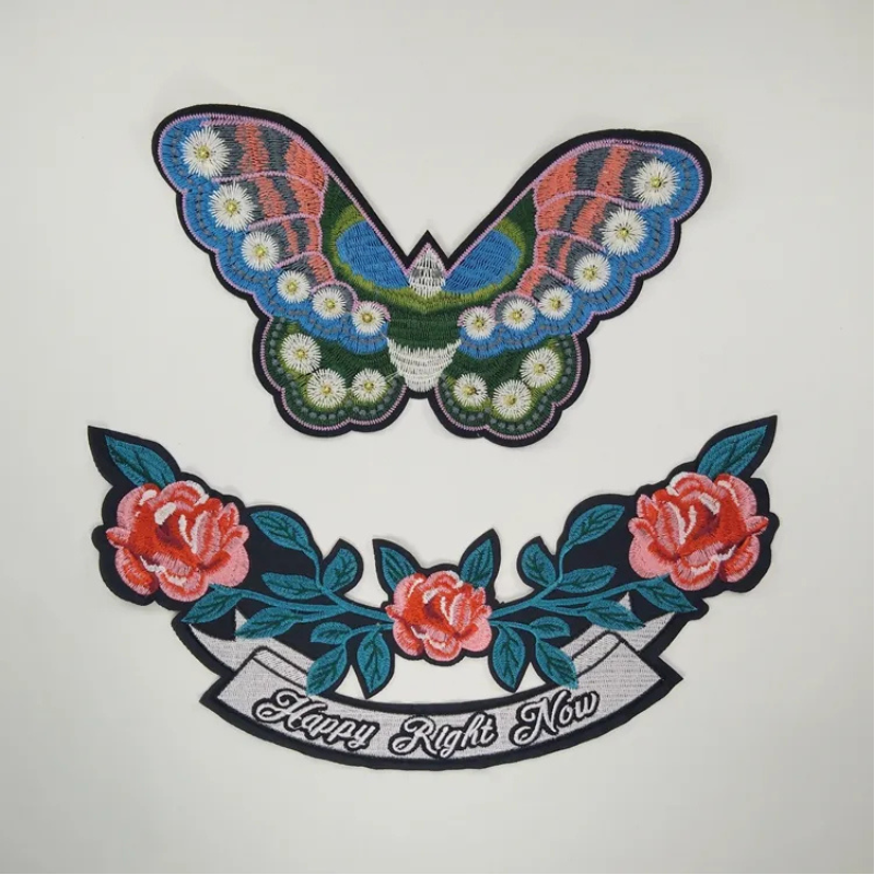 white daisy flower embroidery on black background