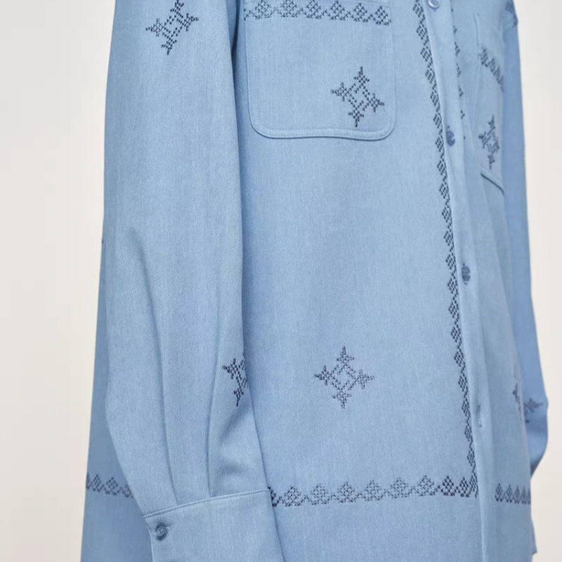 Hand-stitched floral pocket detail
