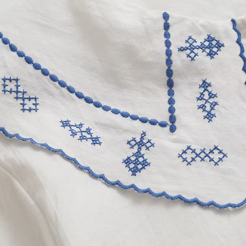 blue-flower-embroidery-pocket-detail-white-shirt.