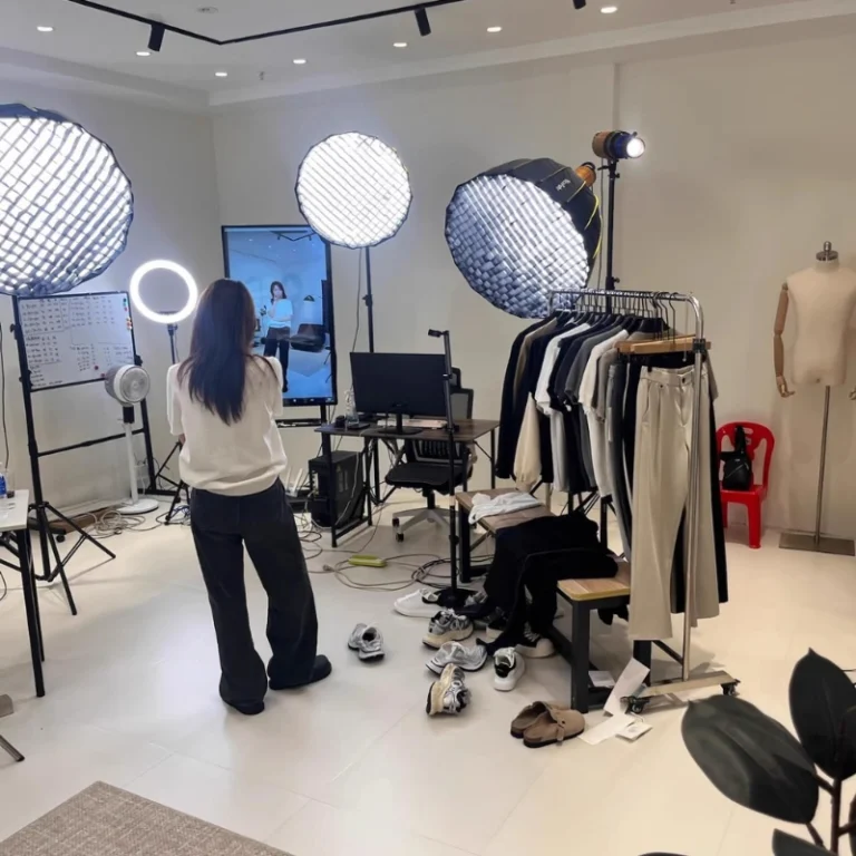 Fashion photoshoot studio with professional apparel photography setup.